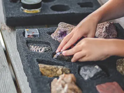 Children explore geology specimens at the Oil Museum of Canada