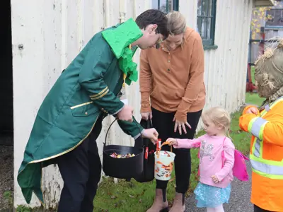 Costumed children trick or treat in the Canadian Pole Drilling Rig in 2023.