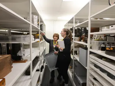 Oil Museum of Canada staff review artifact placement in the new collection storage area.