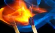 Two lit matches with flames encircling them